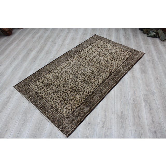 This beautiful, vintage, hand knotted Turkish rug is approximately 60 years old. It is handmade of very fine quality,wool...