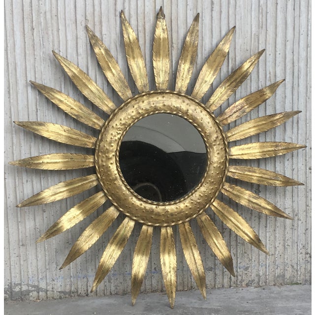 About Mid-Century Modern gilt iron layered leafed flower shaped sunburst mirror. Details PRODUCTION TIME Available Now OF...