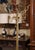 This antique brass and metal free standing halltree was crafted in France, circa 1920. Standing on a tripartite base...