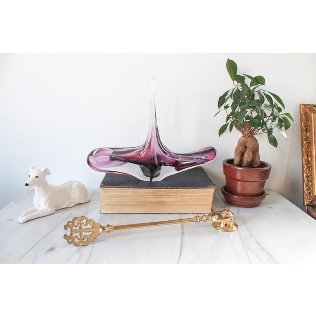 David Goldhagen free-form amethyst art glass sculpture. The sculpture is hand-blown and features clear glass with internal...