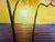 A luminous original oil painting on canvas signed M. Gordon, depicting a tranquil tropical coastline at sunset. Two...