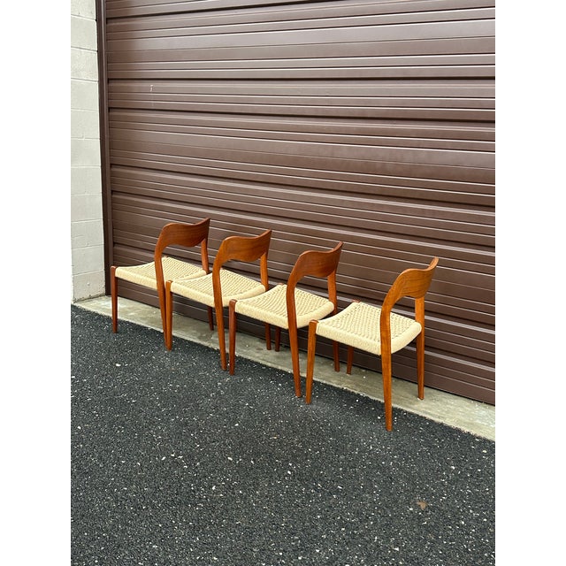Gorgeous set of 4 dining chairs by J.L. Møller. These are model “71”. Excellent original condition with cord in tact and...
