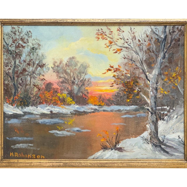 Original oil painting on canvas signed H. Robinson lower left, a winter sunset landscape with a snow lined river, bare...