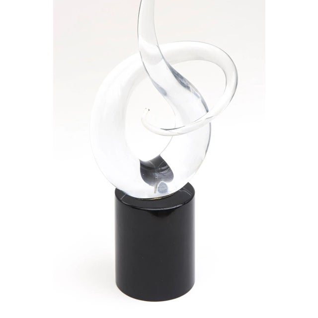 This lovely signed Italian Murano clear and black glass twisted tall sculpture is vintage from the 70's. It is signed...