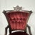 This listing is for an antique Victorian-style parlor chair featuring rich red velvet tufted upholstery and classic turned...