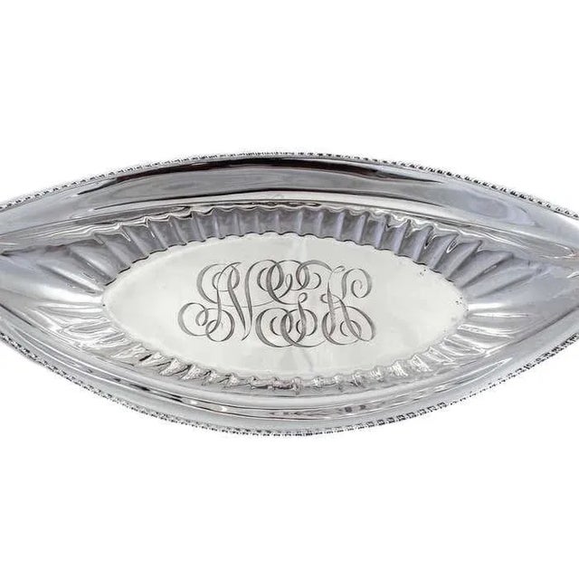 We are happy to offer this lovely sterling silver breadbasket by Towle Silversmiths. It has a canoe-like shape which is...