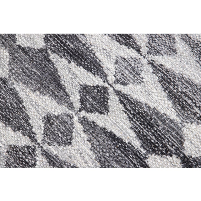 A striking example of Scandinavian textile design, this modern Swedish flat weave rug beautifully captures the essence of...