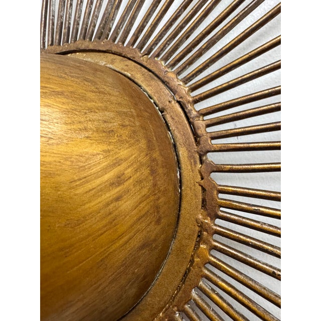 Great vintage starburst wall sculpture with a warm aged brass finish and plenty of presence. Dozens of slender metal rays...