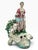 Beautiful antique porcelain pastoral figure depicting a charming shepherdess with a lamb, surrounded by an elaborate...