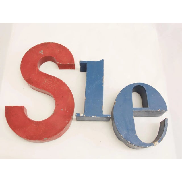 This set of vintage industrial letters was produced in France in the 1940s. The letters spell out the German word Sie...