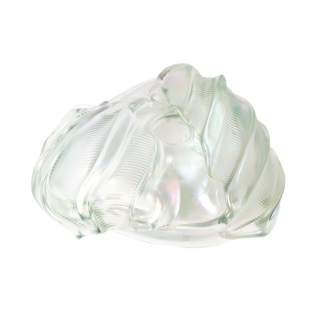 A 1981 art glass vase by American artist Frederick Warren (born 1951). This transparent, iridescent vase features a...