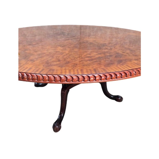 Vintage English Burr Walnut Veneer Round Pedestal Table in the Antique Style with Claw Feet This vintage round pedestal...