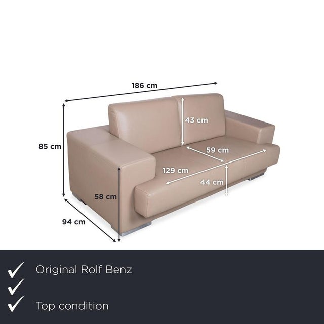 Rolf Benz leather two-seater sofa in cream beige. This model impresses with its timeless design, high-quality...