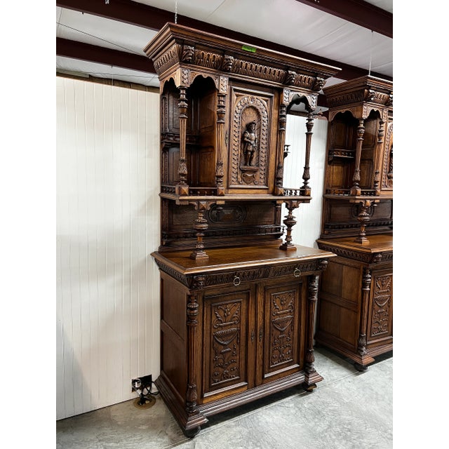 Elevate your space with this breathtaking pair of antique-style hutch cabinets. These pieces are beautifully crafted from...
