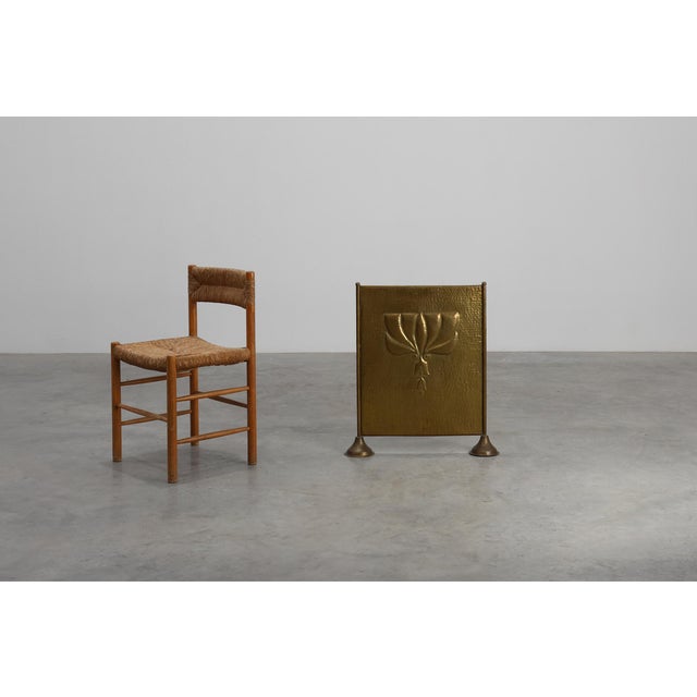 This elegant French fireplace screen from the 1920s captures the refined geometry and handcrafted spirit of the Art Deco...