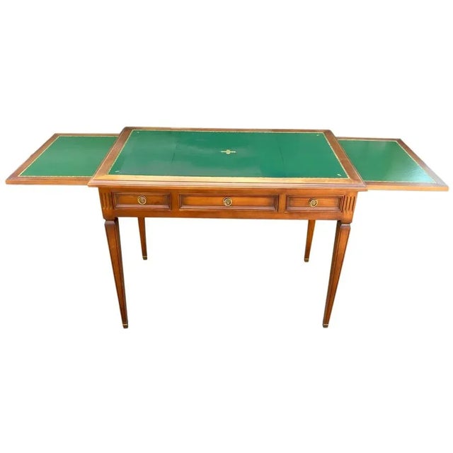 Beautiful Louis XVI style extendable desk with a three-drawer extension and lovely green leather. In very good condition....