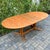 Scandinavian mid century modern teak dining table on trestle base with internal leaf storage, made in Denmark by Skovby c....