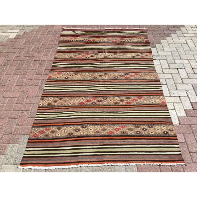 This beautiful, vintage, handwoven kilim is approximately 60 years old. It is handmade, of very fine quality hand spun...