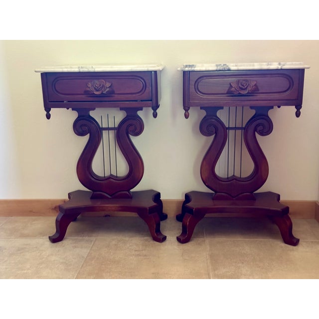 This elegant pair of vintage nightstands (or side/end tables) beautifully captures Victorian and Neoclassical revival...