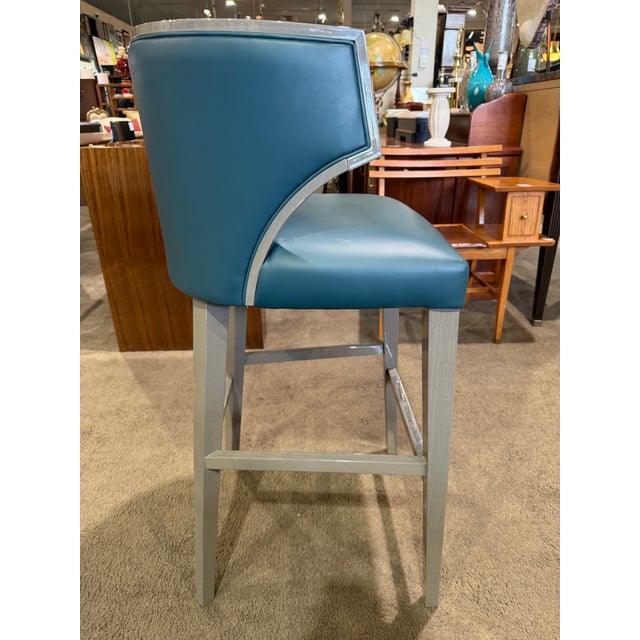 The Pietro Costantini Villa Bar Stool is a sophisticated expression of contemporary Italian design, balancing...