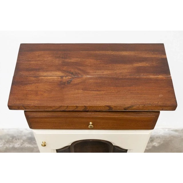 Handcrafted solid oak display cabinet shaped door with leaded glass, two drawers (top and bottom) with brass knobs, turned...