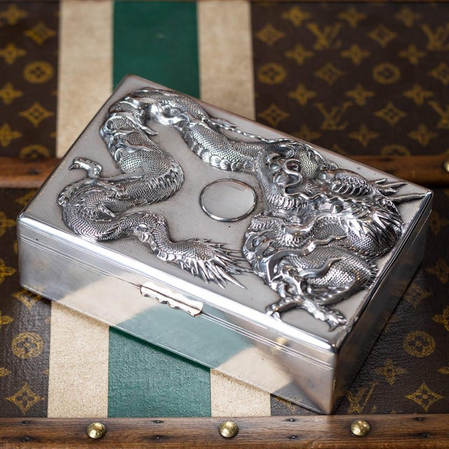 Antique early 20th Century Japanese Meiji period solid silver humidor box. The surface is adorned with an intricate high...
