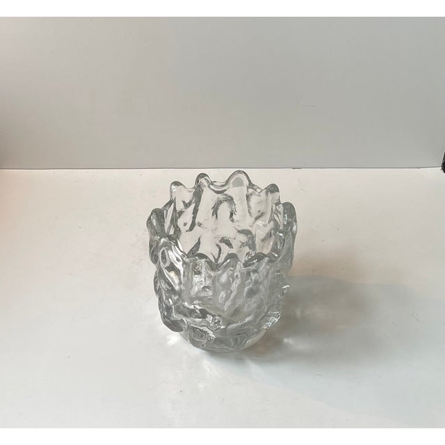 A large freeform vase in organically molded crystal glass. It is a unique piece designed by the conic swedish glass wizard...