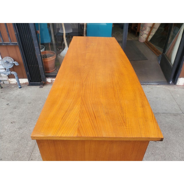 Vintage early 50s, mid-century credenza. The credenza has four fully functional drawers that work smoothly. The right side...
