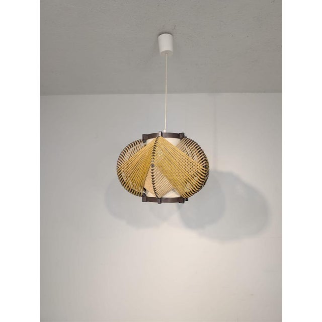 Vintage MK Leuchten Pendant Lamp from the 1970s Stylish, vintage pendant lamp from the 1970s. Made of plastic and braided...