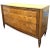 Slightly curved Art Deco chest of drawers in elm burl and walnut. It opens with four drawers with brass handles. The gold-...
