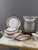 An elegant limoges porcelain dinner service, signed leclaire limoges france, featuring a refined classic design in...
