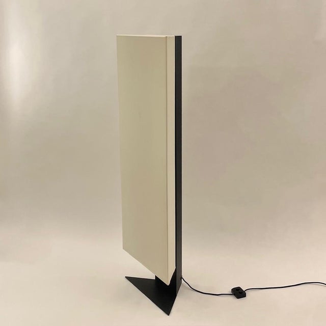 Rare "Accademia" floor lamp by Cini Boeri, produced by Artemide in Italy around 1978. A triangular structure covered in...