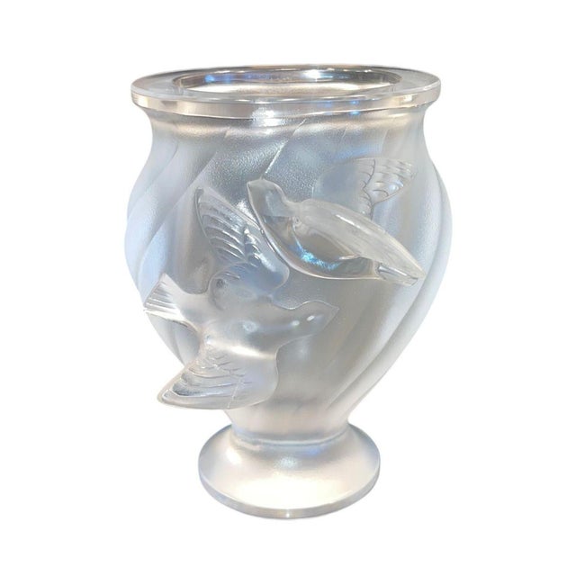 An elegant set of four signed Lalique crystal pieces comprising the iconic “Rosine” vase and three frosted crystal sparrow...