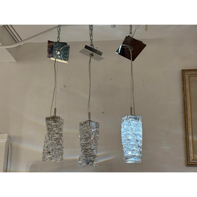 Design Plus Gallery presents Set of Three Glissando LED Mini Pendants from Swarovski.The pendants are named for a...