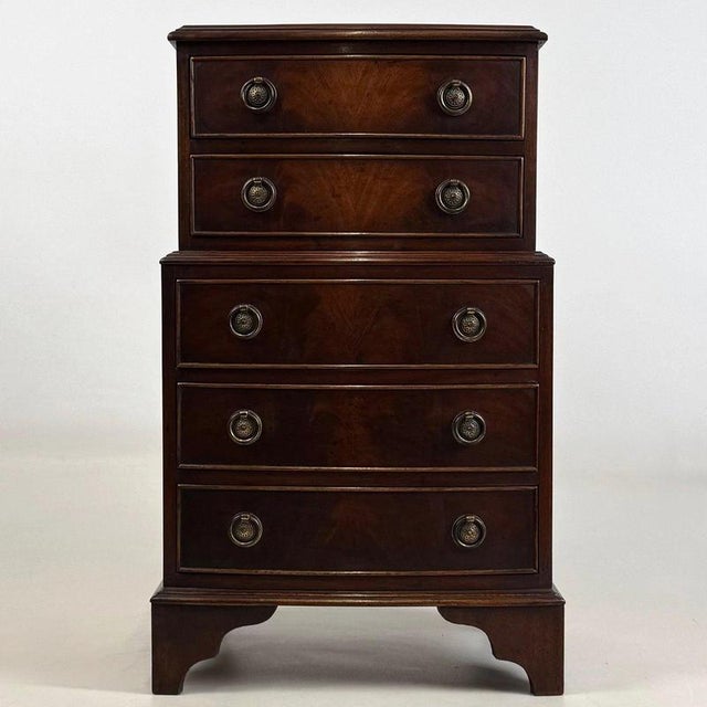 A charming and beautifully proportioned early 20th-century English chest of drawers, finely constructed in mahogany and...