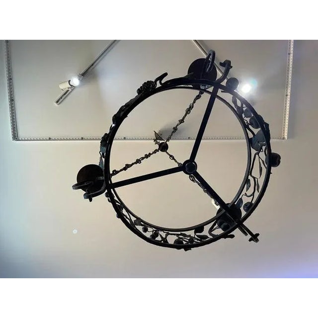 This stylish Spanish Colonial style chandelier was acquired from a Palm Beach home, and the piece is attributed to Addison...