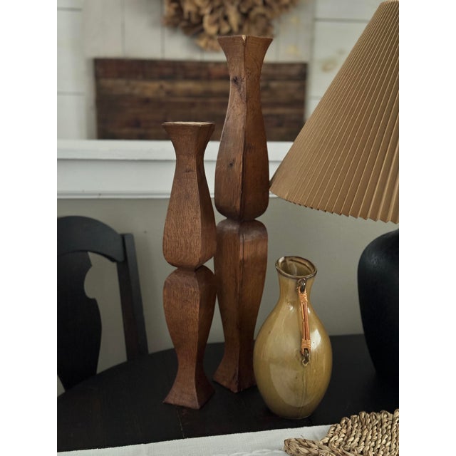 A gallery-level pair of hand-carved wooden totems, sculpted in the 1970s in the organic modern tradition. Crafted in...