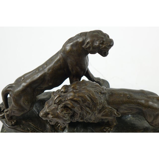 Roaring Lion and Lioness Sculpture by Thomas Cartier – Dramatic Art Deco Masterpiece Capture the raw power and majestic...