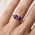 Celebrate love, friendship, or a beautiful milestone with this elegant 18k gold-plated two-stone ring. Featuring a pair of...