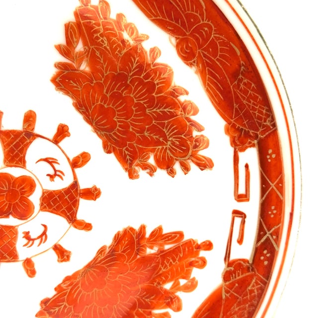 Beautiful hand painted Plate of cinnabar or orange with gold over white porcelain. Complete with a hardwood stand of...