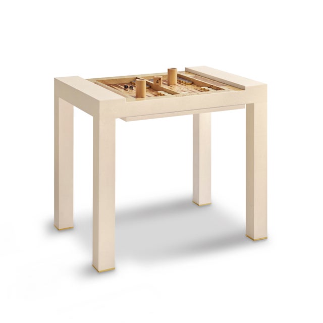 This versatile faux shagreen table with brass detailing comes with a recessed backgammon board and reversible lid...