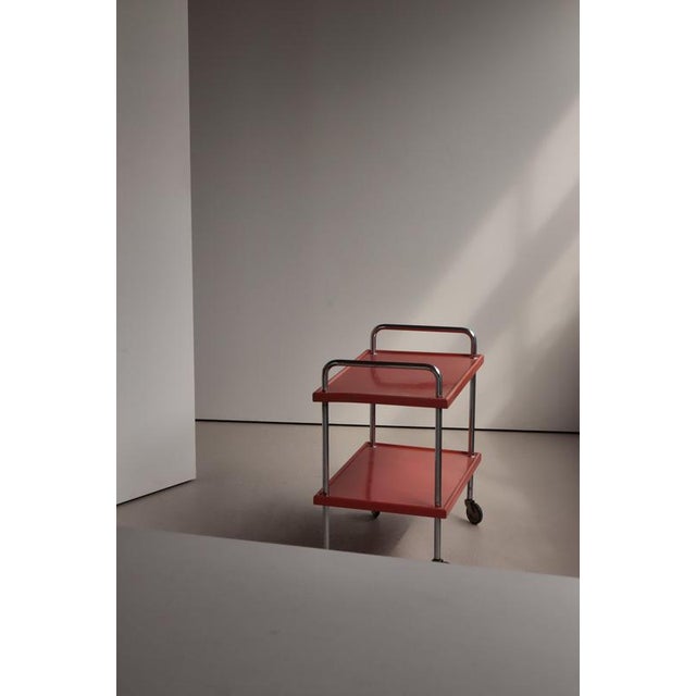 Striking 1930s Scandinavian functionalism serving cart featuring a beautifully restrained combination of tubular chrome-...