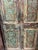 Six hand-carved panels, each blooming with floral and leaf motifs, layered over reclaimed wood that wears its age with...