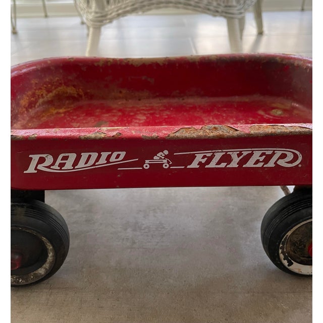 This vintage Radio Flyer Wagon is small; a child's size wagon. It would be a great decorative piece for a child's bedroom,...