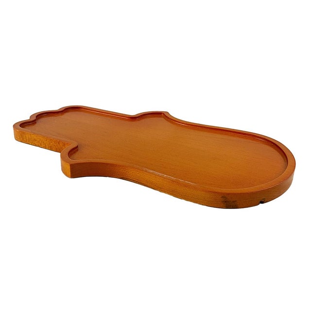 This handcrafted Hamsa Hand Tray is carved from solid maple and finished in a warm custom stain that highlights the...