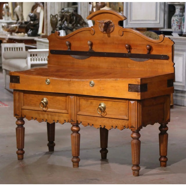This antique "Billot de Boucher", or butcher block was crafted in France, circa 1890. The piece stands on fluted and...