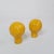 Pair of large round, organic shaped, ceramic lamp finials in mustard yellow. These organic shaped, ceramic finials were...