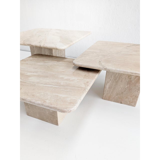 Set of 3 beige corallo marble nesting tables from 1970's italy. Crafted from natural marble, these nesting tables radiate...