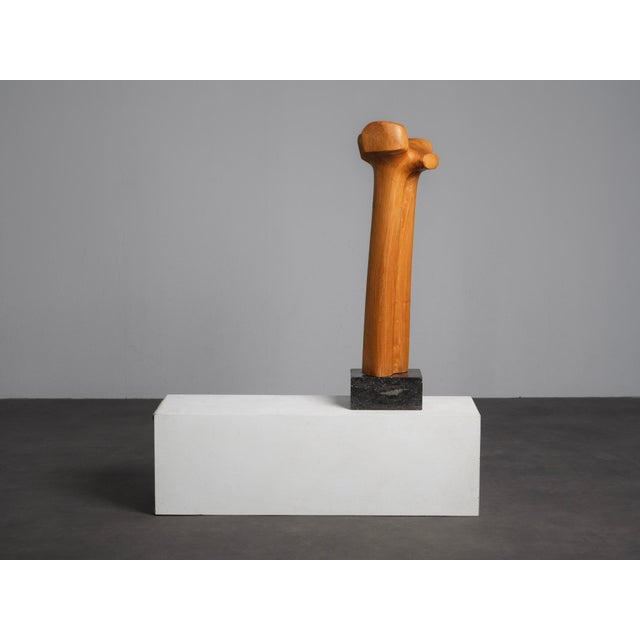 A striking biomorphic sculpture from the netherlands, dating from the 1970s. Hand-carved from plum wood, the tall...