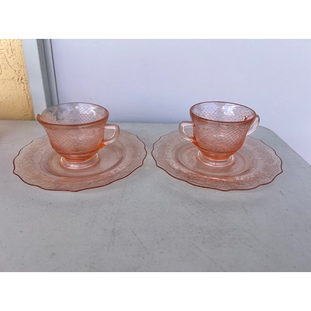 Beautiful Pink depression glass with embosed designs of floral Bouquet & Lattice patterns. The plates have a scalloped...